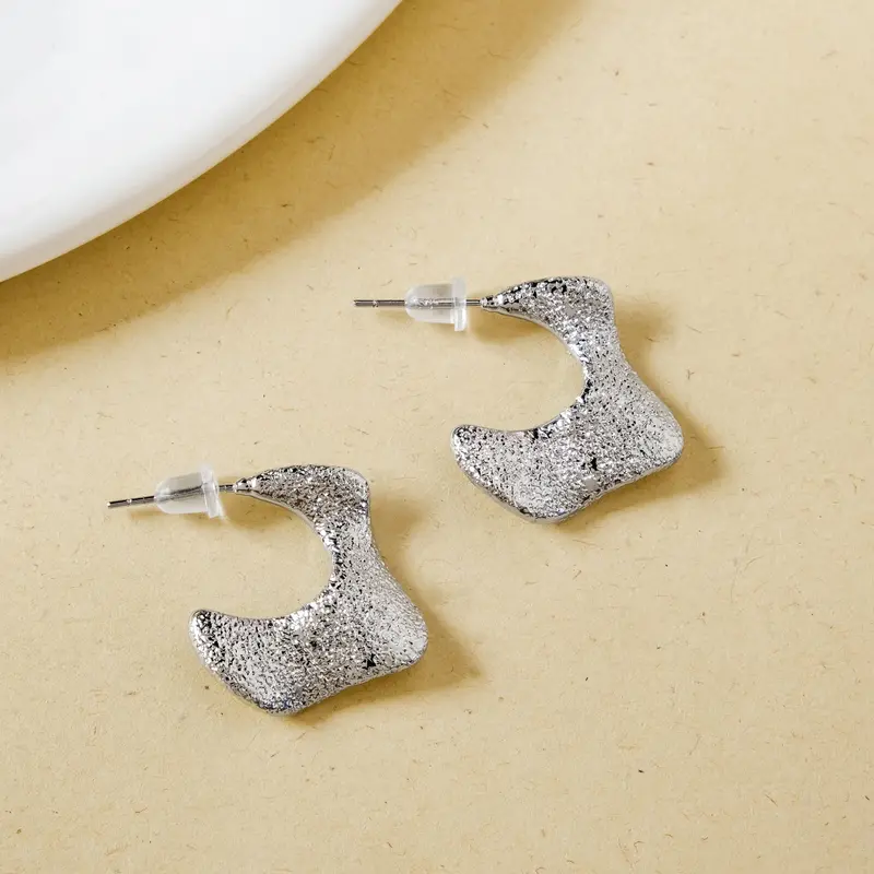 Abstract Silver Crater Huggies – Industrial-Inspired Minimalism 1