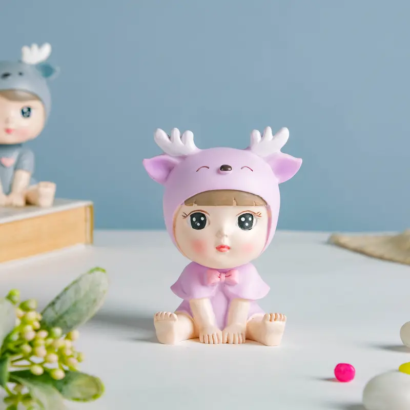 Adorable Toddler Girl Figurine Wearing Deer-Themed Hat 1