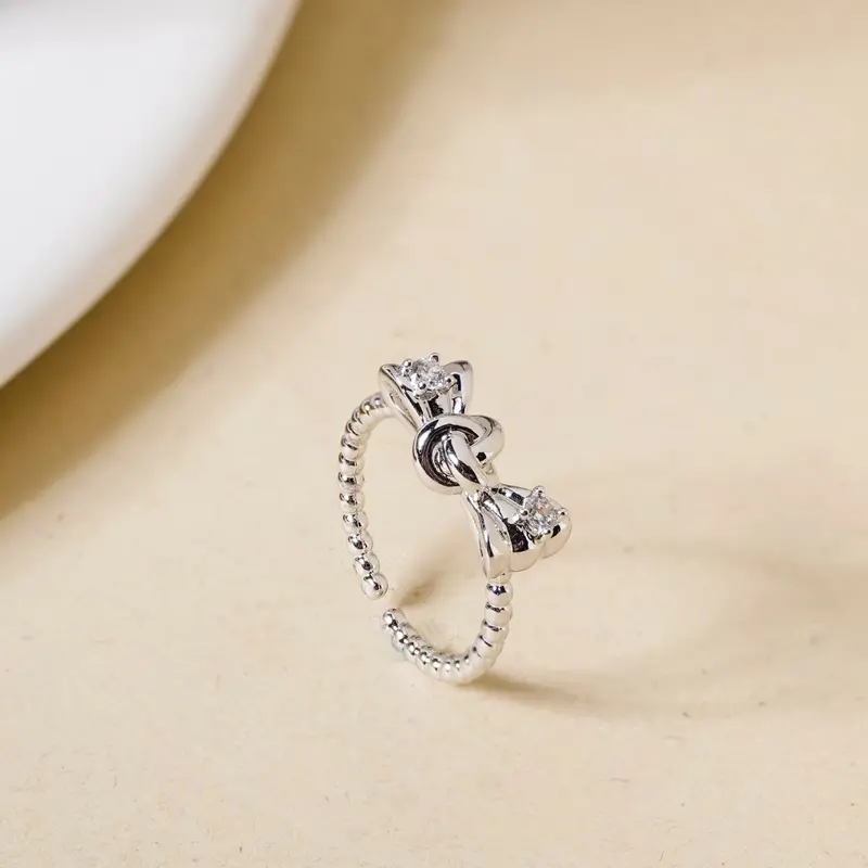 Elegant Bowtie-Inspired Silver Ring With Gemstone Detail 1