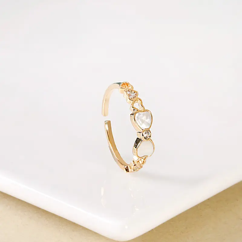 Gold Bow-And-Hearts Accent Ring 1