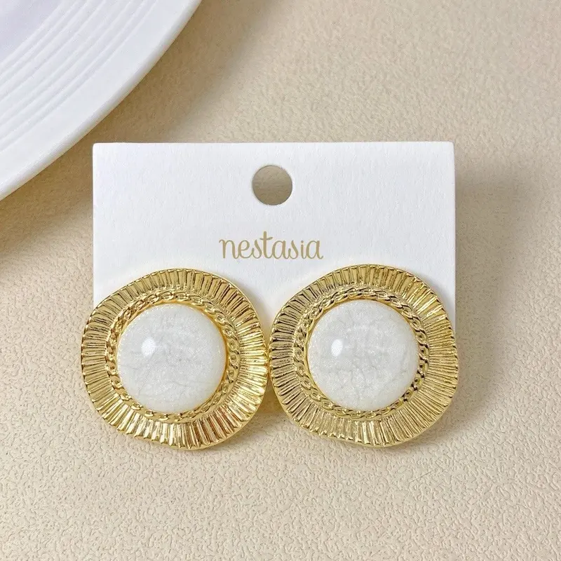 Lunar-Inspired Gold And White Studs 1