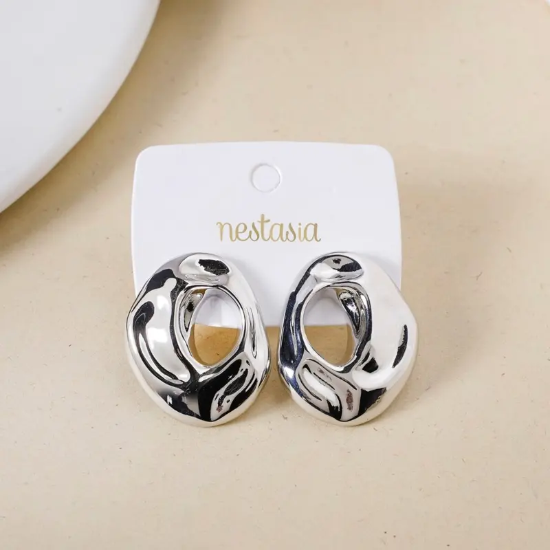 Oval Hollow Silver Statement Earrings With Fluid Design 1