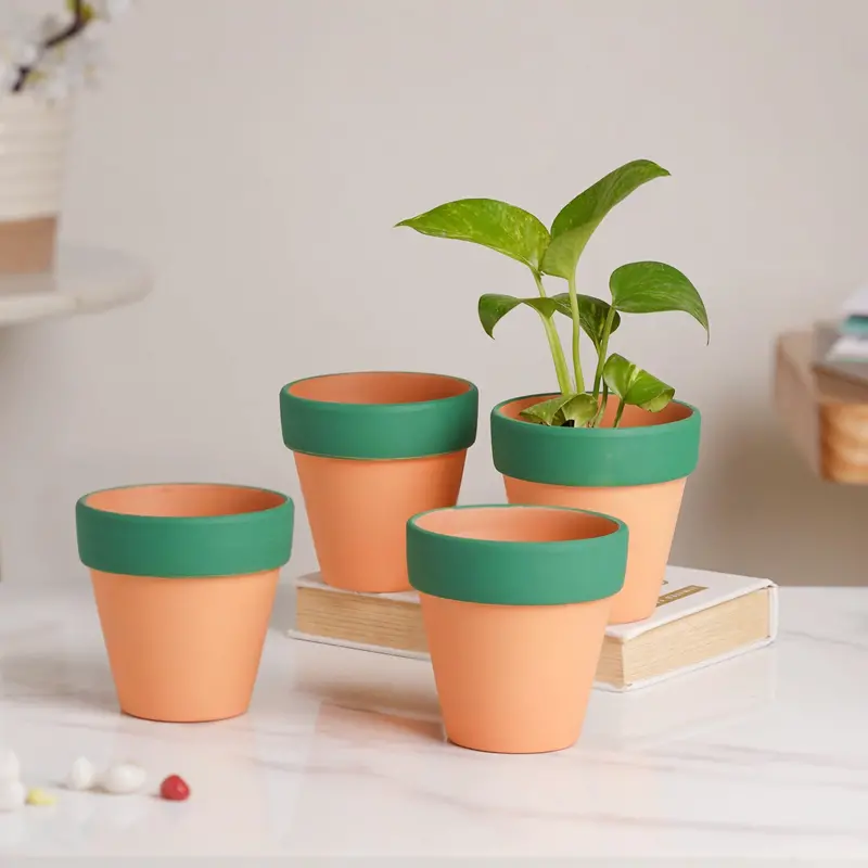 Set Of 4 Handcrafted Orange Clay Pots With Green Rims 1