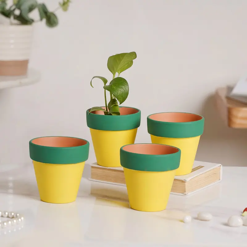 Set Of 4 Yellow Clay Pots With Green Accented Rims 1