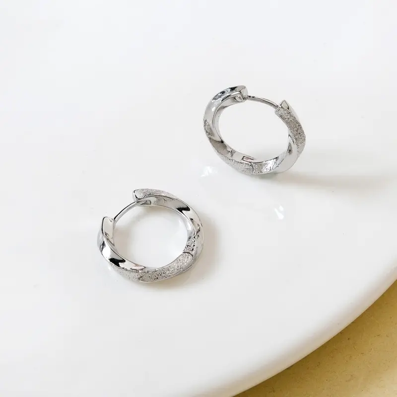 Silver Swirl Hoop Earrings – Elegant Twisted Silhouette 1